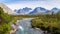 Scandinavian landscape with rapids in a river and a glacier in