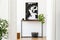 Scandinavian living room with wooden console table and map poster.