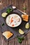 Scandinavian ,Norwegian fish soup on a rustic wooden background. Salmon soup with potatoes, carrots, cream. View from above.