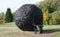 The scarab statue rolling a huge ball . The sculpture, completely made of old car tires