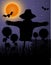 Scarecrow black silhouette in the night sky and the moon