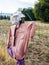 Scarecrow on farm fence