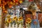 A scarecrow with sunflowers and colorful leaves