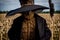 A Scarecrow Wearing A Black Hat And A Black Jacket. Generative AI