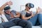 Scared couple wearing VR glasses