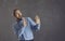 Scared man doing stop gesture afraid of terrible danger isolated on grey background