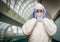 Scared Man Holding Head With Hands Wearing HAZMAT Protective Suit