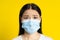 Scared of pandemic mature asian woman wearing medical face mask coronavirus or monkeypox prevention. Charming middle age