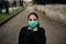 Scared sick woman wearing protective mask.Suffering from infectious disease.Infected patient suffering from symptoms of illness.