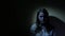 Scared teen girl in a dark. 4K UHD.