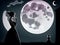 Scared woman in a dress looking out at the moon ominous presence seq 2 of 16