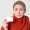 Scared woman holding business or credit card for presentation