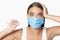 Scared Woman In Mask Showing Thermometer Having Fever, White Background