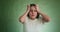 Scared woman wearing t-shirt clutches head playing role