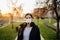 Scared young adult affected by the COVID-19.Walking,going to work during pandemic.Protective measures,wearing N95 mask.Respecting