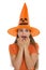 Scared young woman in Halloween hat