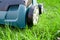 Scarifier on green grass. Work in the garden. scarifier