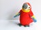 Scarlet Macaw with a band of yellow followed by a band of blue leading to the flight feathers, a cute children toy, red bird with