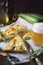 Scarpaccia, Italian cuisine. Thin zucchini pie and mug of light beer