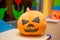 Scary artificial hand made pumpkin decoration in the kids club during Halloween