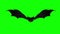 Scary bat hovering against green background. Halloween background