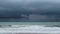 Scary black cumulonimbus cloudscapce & Dark storm clouds over green raging sea water surface