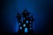 Scary castle silhouette,black paper bats and witch on broom flying on dark blue background.