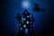 Scary castle silhouette,black paper bats and witch on broom flying on dark blue background. Halloween concept.