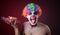 Scary clown with spooky makeup and more candy