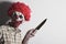 Scary evil clown with a big knife