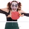 Scary female clown is playing ping-pong