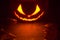 Scary halloween night with spooky evil face of jack o lantern at the top