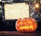 Scary halloween pumpkin with empty sign board