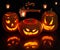 Scary Halloween Pumpkins in the dark with reflection.