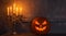 Scary laughing pumpkin and old skull on ancient gothic fireplace. Halloween, witchcraft and magic.