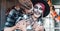 Scary love romantic family couple man,woman celebrating halloween.Terrifying black skull half-face makeup,witch costumes