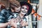 Scary love romantic family couple man,woman celebrating halloween.Terrifying black skull half-face makeup,witch costumes