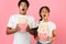 Scary movie. Frightened couple throwing popcorn over background