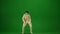 Scary mummy wrapped in bandages dances wearing a black hat and sunglasses. Green screen isolated chroma key. Mock up