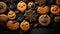 Scary orange gingerbread cookies in the shape of evil pumpkins, cobwebs close up isolated on black background