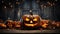 Scary pumpkin lanterns and lights in old wood barn on Halloween night