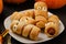 Scary sausage mummies in dough with funny eyes on table