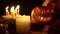 Scary toothy pumpkin Jack in many candle on Halloween loop video