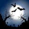 Scary vector haloween landscape with a graveyard and flying bats in full moon.