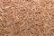 Scattered brown flat vermicelli texture. Pastry pattern, food background, texture idea.