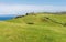 Scattered clifftop ruins of a medieval castle, former seat of the Clan MacDonald, abandoned in 1739