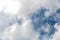 Scattered cloud clusters in a blue sky, blue sky background with white clouds