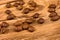 Scattered coffee beans on a wooden table