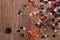 Scattered colorful sewing buttons on a wooden background