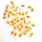 Scattered corn kernels. Corn as a dish of thanksgiving for the harvest, picture on a white isolated background